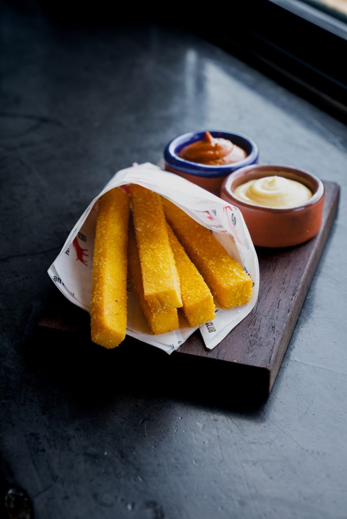 Chickpea goats cheese parmesan triple-cooked fries served with truffle aioli & smoked ketchup