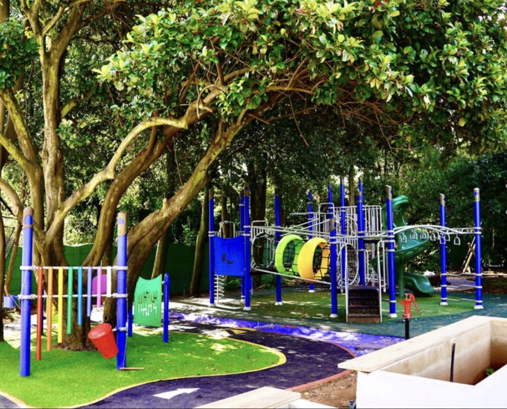 The outdoor play area at Joy Jozi features an obstacle course