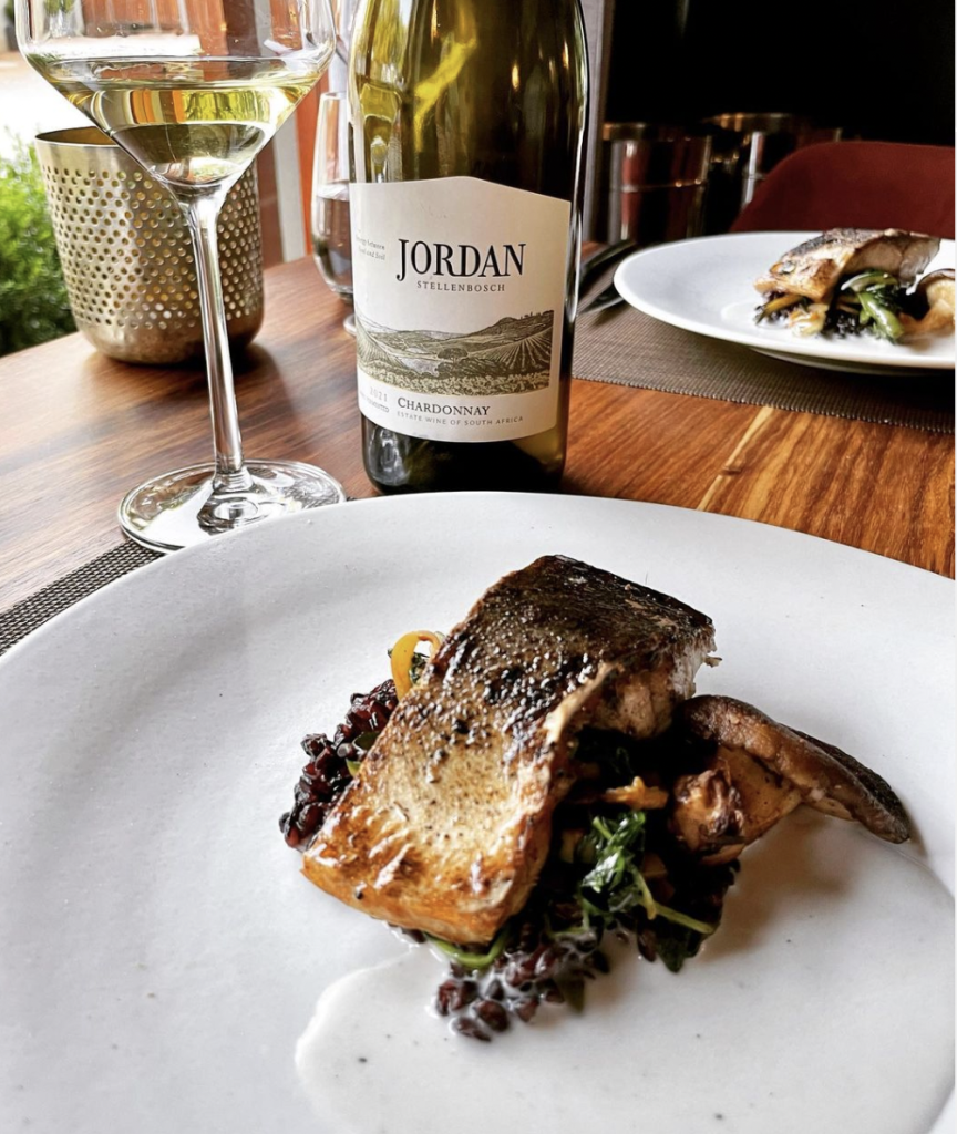 Basalt's crispy skinned line fish with sticky black rice and Tom yum jus.